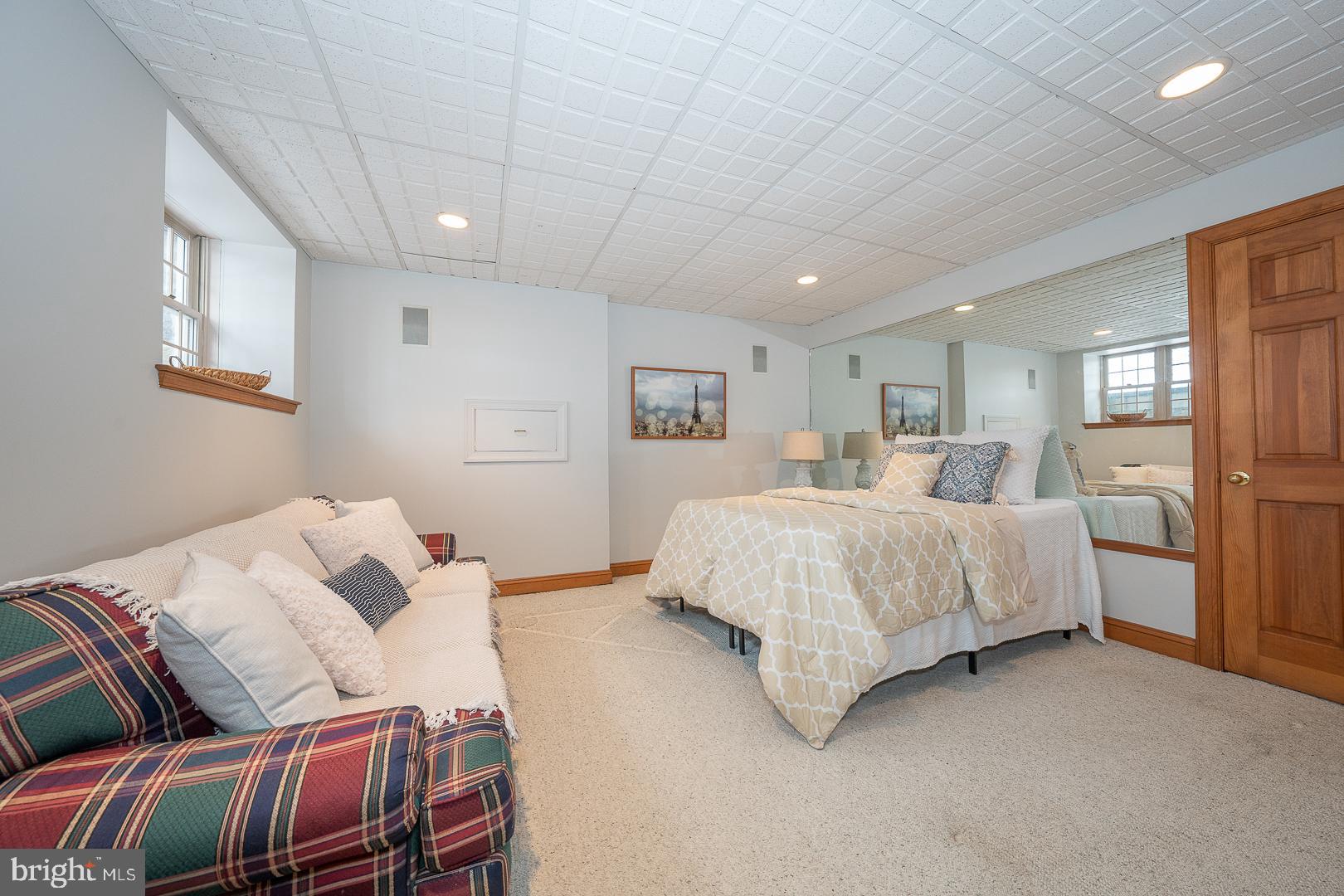 400 Orchard Way Wayne, PA 19087 - Photo 45 of 60 a spacious bedroom with a bed and a couch