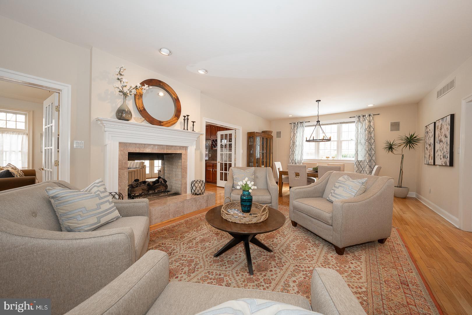 400 Orchard Way Wayne, PA 19087 - Photo 6 of 60 a living room with furniture a fireplace and a window