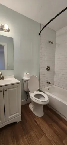 a bathroom with a toilet a sink and bathtub
