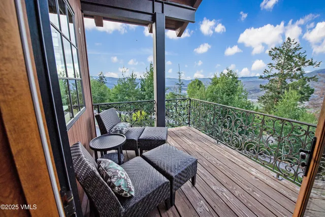 a view of a balcony with chairs