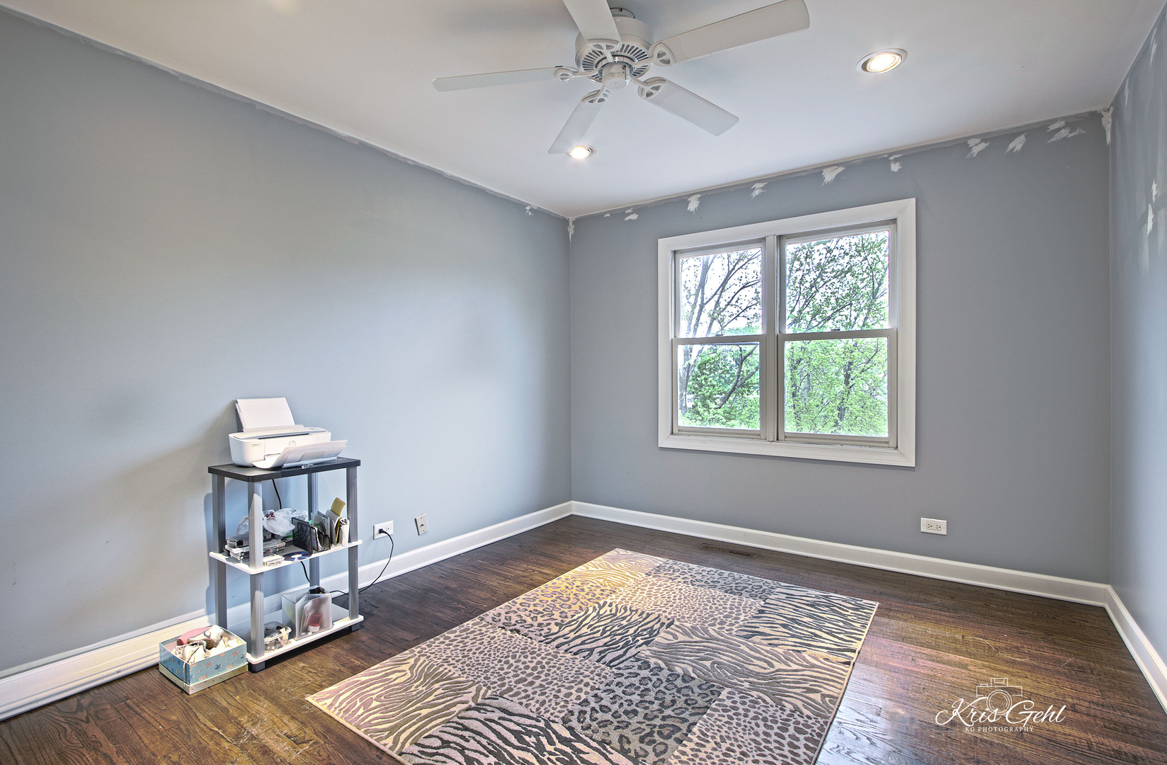 Undisclosed Address Lindenhurst, IL 60046 - Photo 13 of 32 a room with a window and wooden floor