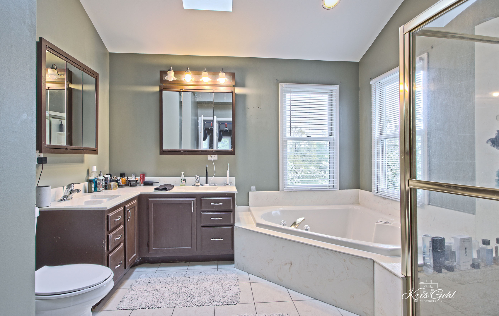 Undisclosed Address Lindenhurst, IL 60046 - Photo 17 of 32 a bathroom with a bathtub sink mirror vanity and toilet