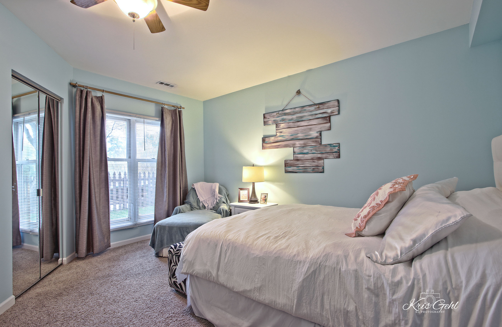 Undisclosed Address Lindenhurst, IL 60046 - Photo 20 of 32 a bedroom with a bed and a chandelier