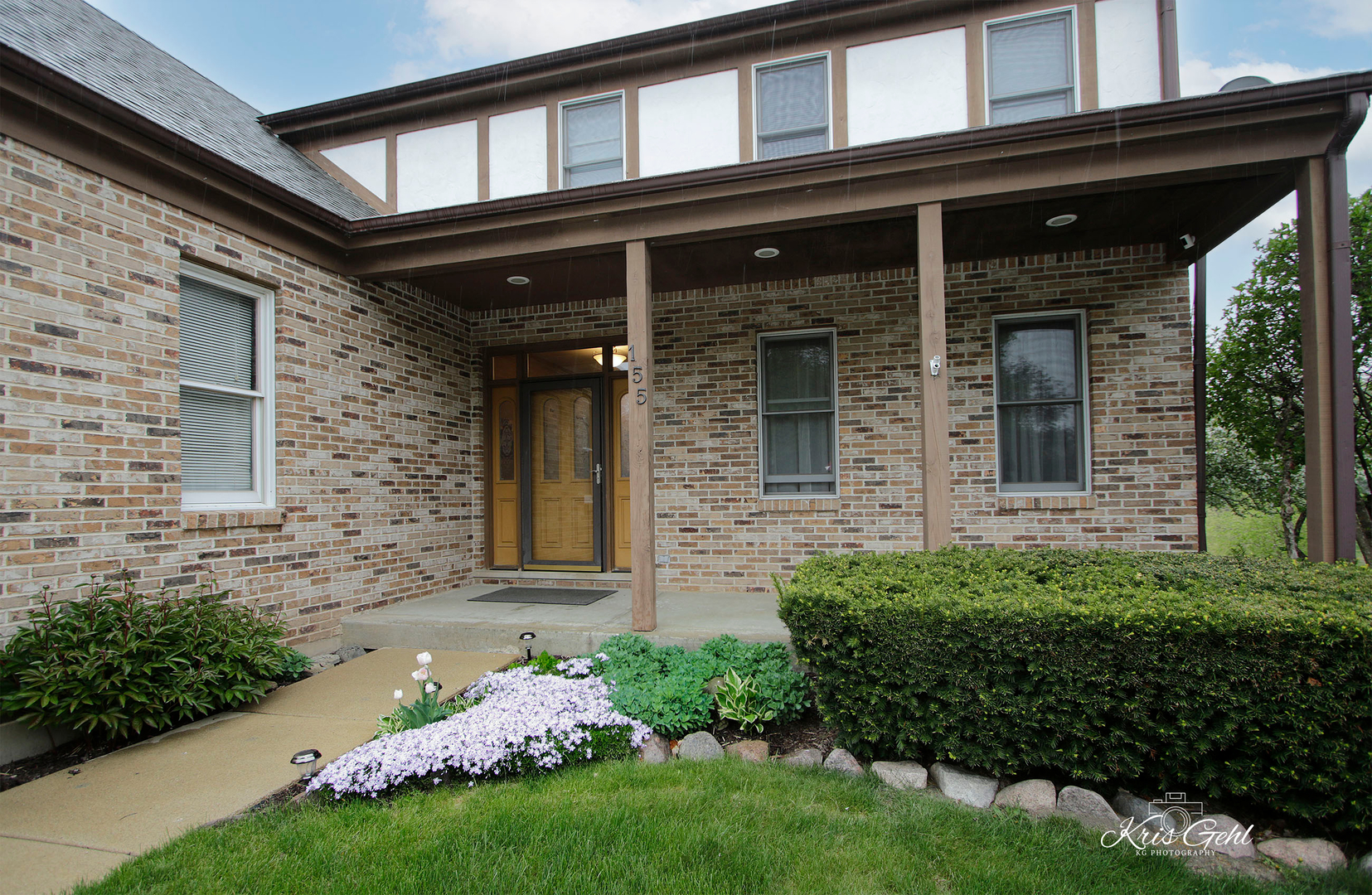 Undisclosed Address Lindenhurst, IL 60046 - Photo 2 of 32 front view of a brick house with a yard
