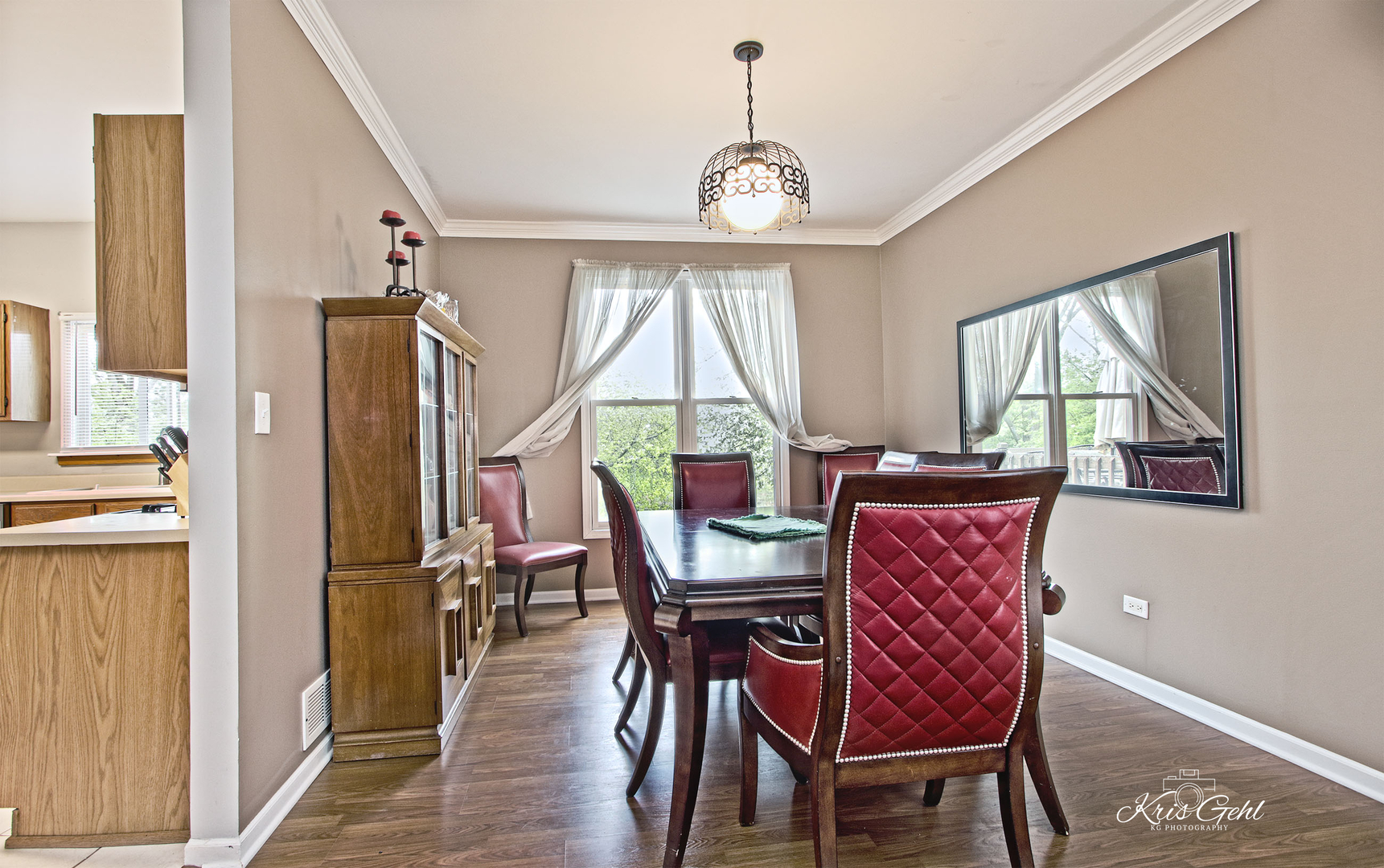 Undisclosed Address Lindenhurst, IL 60046 - Photo 5 of 32 a dining room with furniture a chandelier and wooden floor