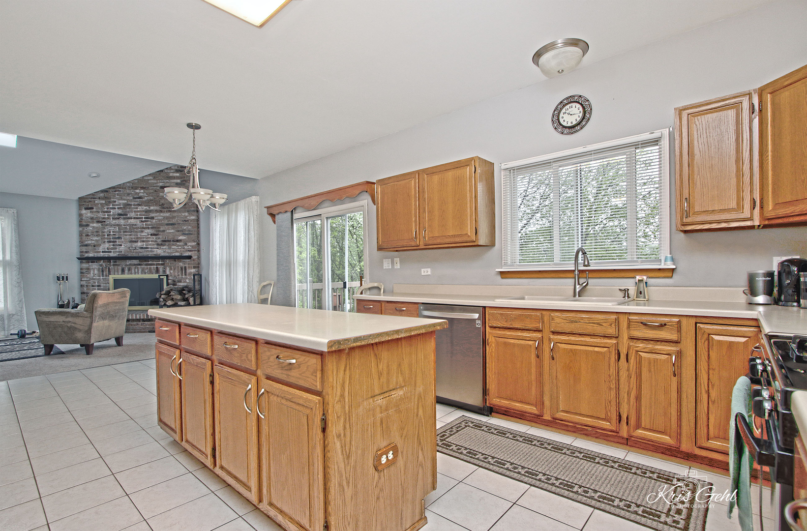Undisclosed Address Lindenhurst, IL 60046 - Photo 6 of 32 a kitchen with stainless steel appliances a sink stove and cabinets
