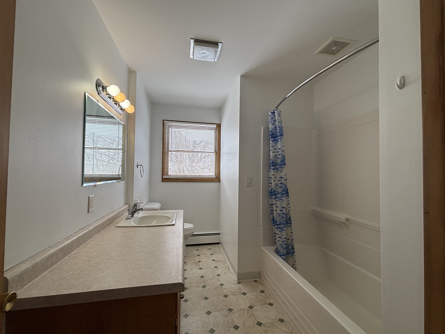 2208 Stieg Road Woodstock, IL 60098 - Photo 11 of 15 a bathroom with a sink a toilet and shower