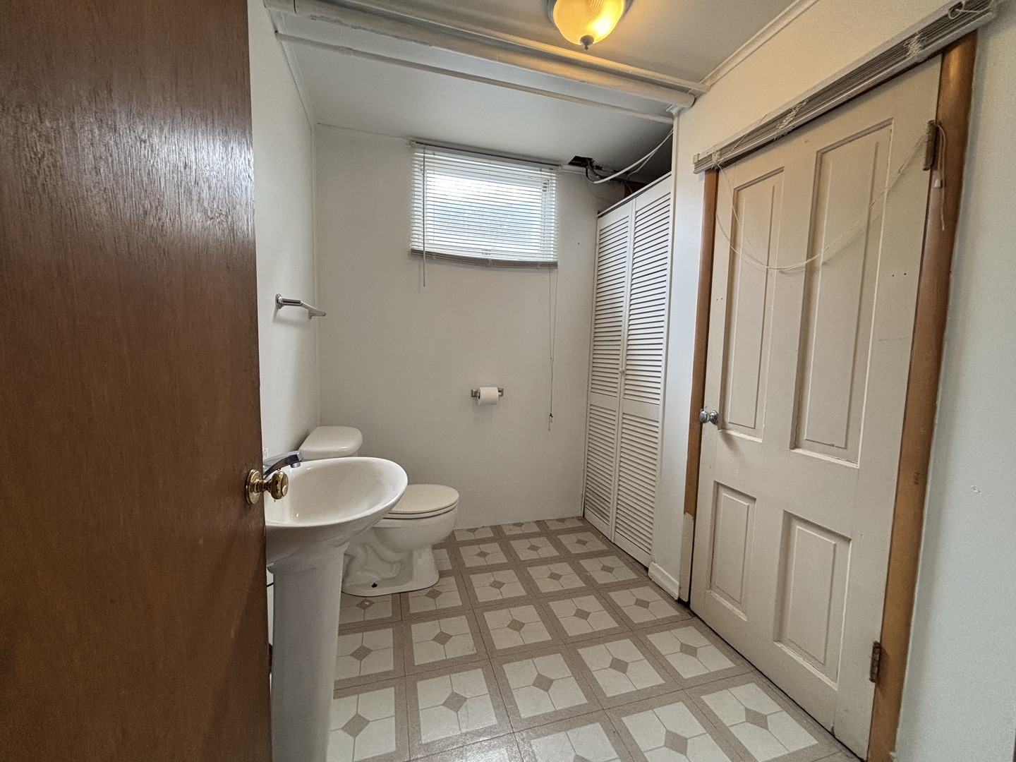 2208 Stieg Road Woodstock, IL 60098 - Photo 13 of 15 a bathroom with a sink toilet and shower
