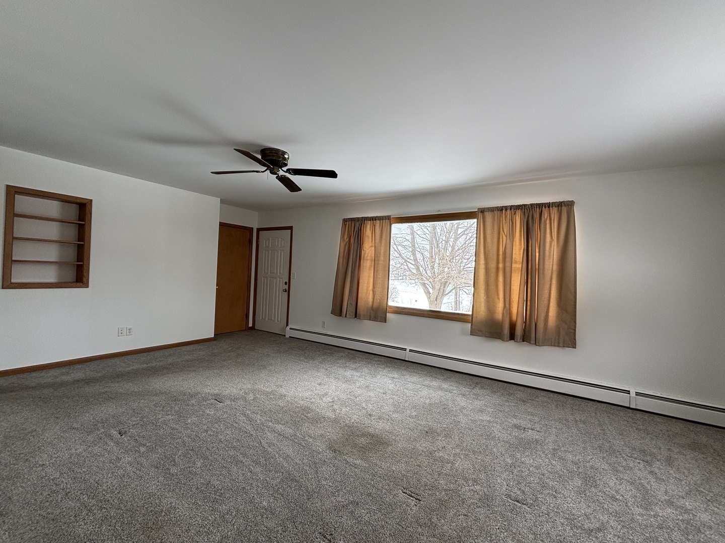 2208 Stieg Road Woodstock, IL 60098 - Photo 6 of 15 a view of an empty room with a window