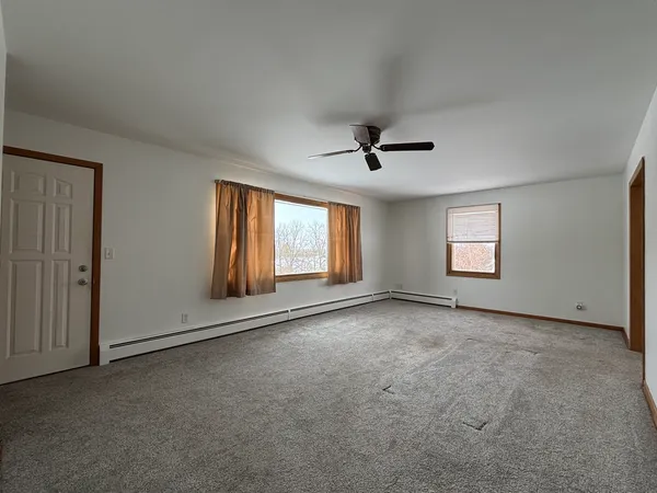 a view of empty room with windows