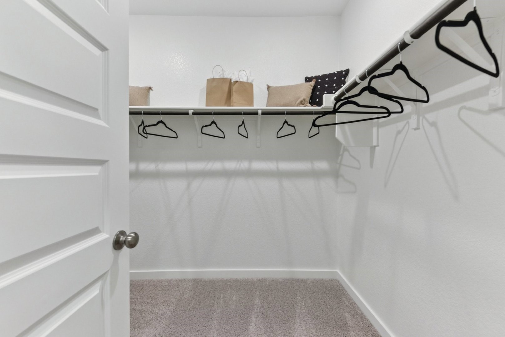 233 Escape Way Jarrell, TX 76537 - Photo 10 of 22 a view of a room with racks on the wall