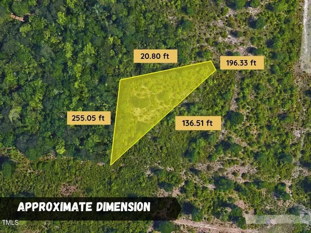 a sign that is sitting on a lush green field