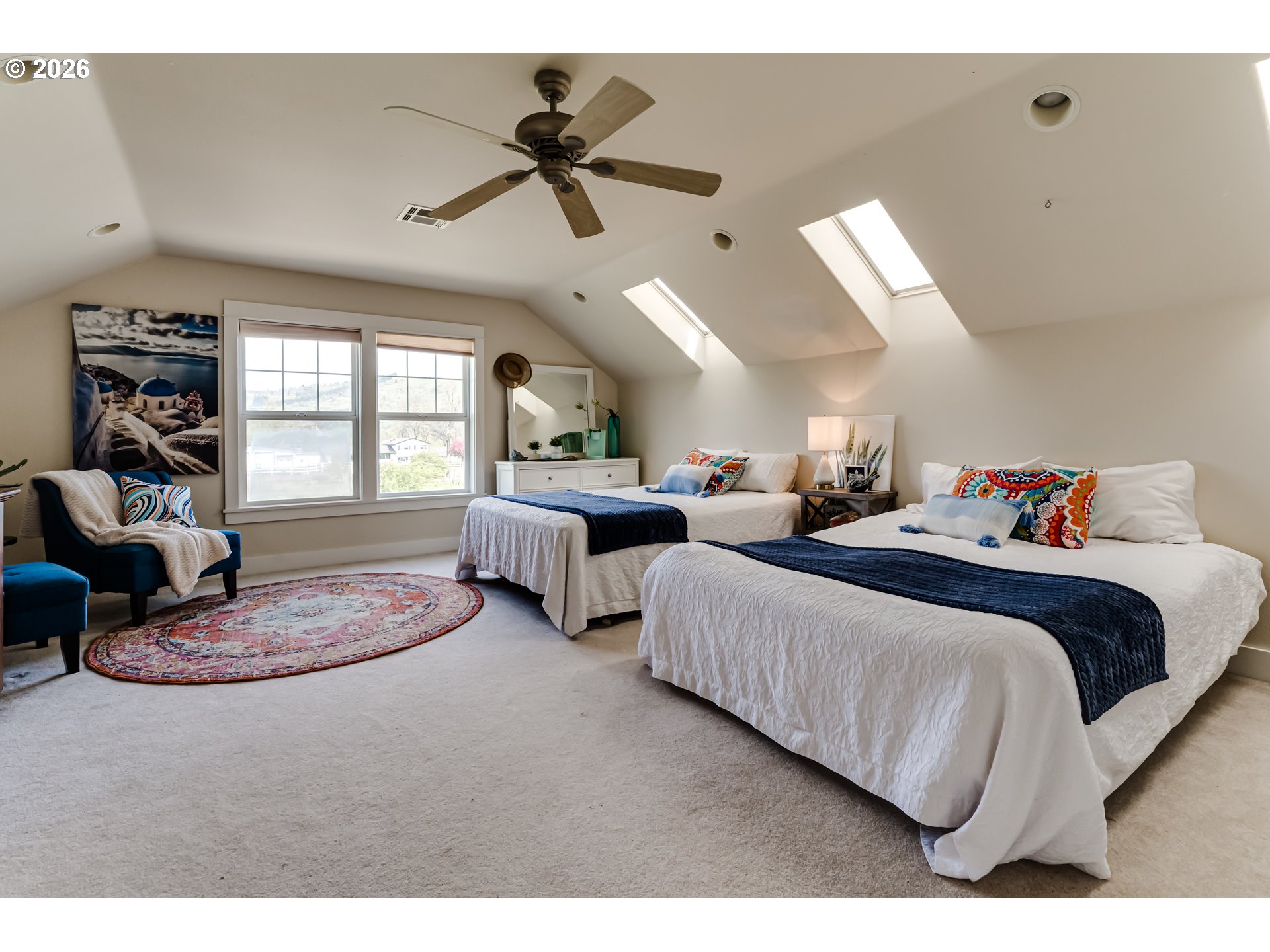 34386 Mathews Road Eugene, OR 97405 - Photo 44 of 48 a spacious bedroom with two beds and a chandelier