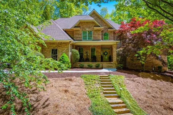 a front view of a house with a yard