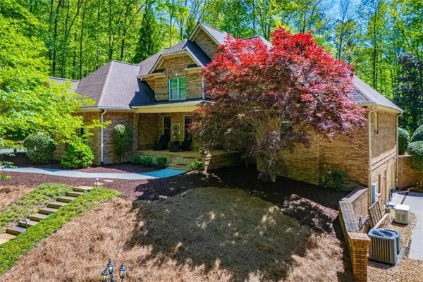 a front view of a house with garden