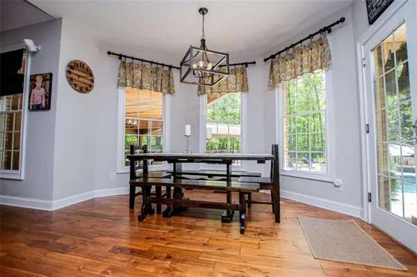 a bed room with a bed and a chandelier