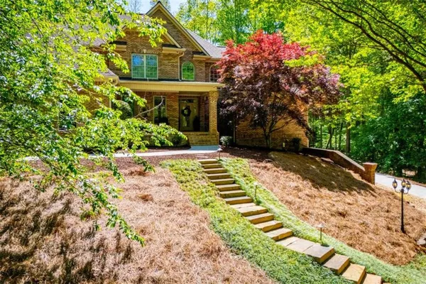 a front view of a house with a yard