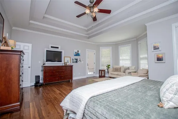 a view of a dining room with furniture wooden floor and a rug