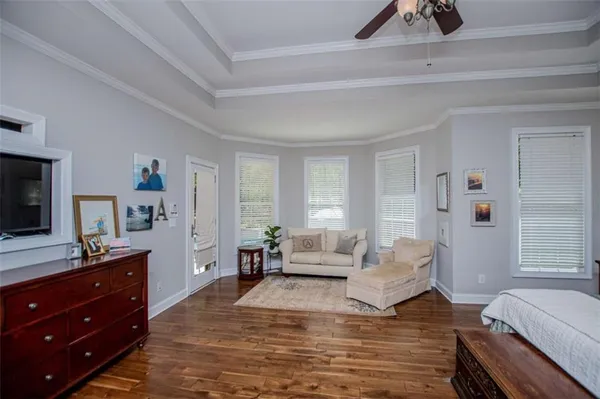 a bedroom with bed and tv