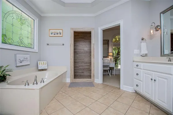 an empty room with closet and wooden door