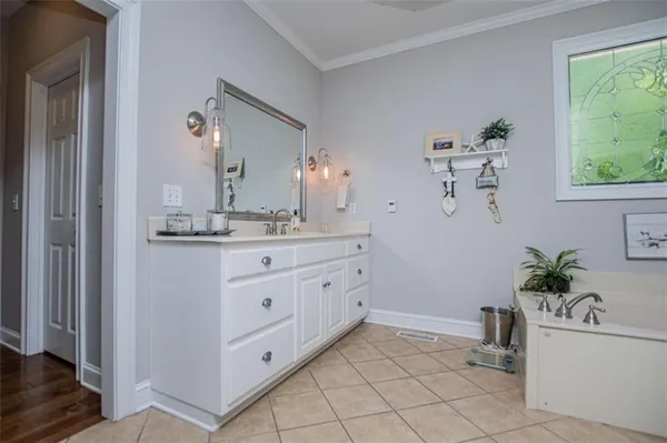 a bathroom with a toilet a sink and a mirror
