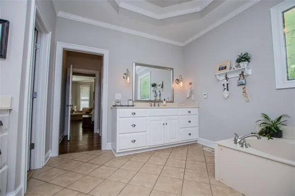 a bathroom with a toilet a sink and a mirror