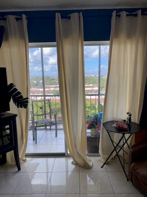 4174 Inverrary Drive, Unit 1015 Lauderhill, FL 33319 - Photo 14 of 15 a living room with furniture and a window