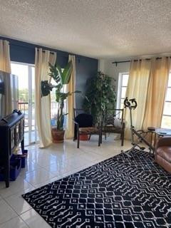 4174 Inverrary Drive, Unit 1015 Lauderhill, FL 33319 - Photo 5 of 15 a living room with furniture and a potted plant
