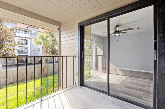 a view of a glass door and the balcony