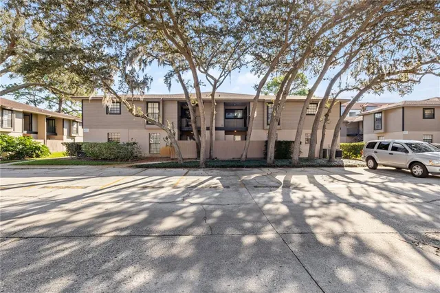 a view of a house with a snow in the yard