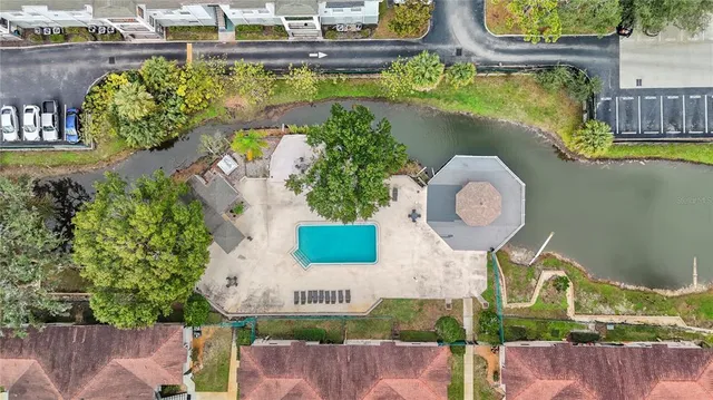 an aerial view of a house with a swimming pool