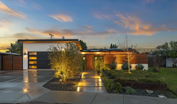 a view of a fountain in front of a house