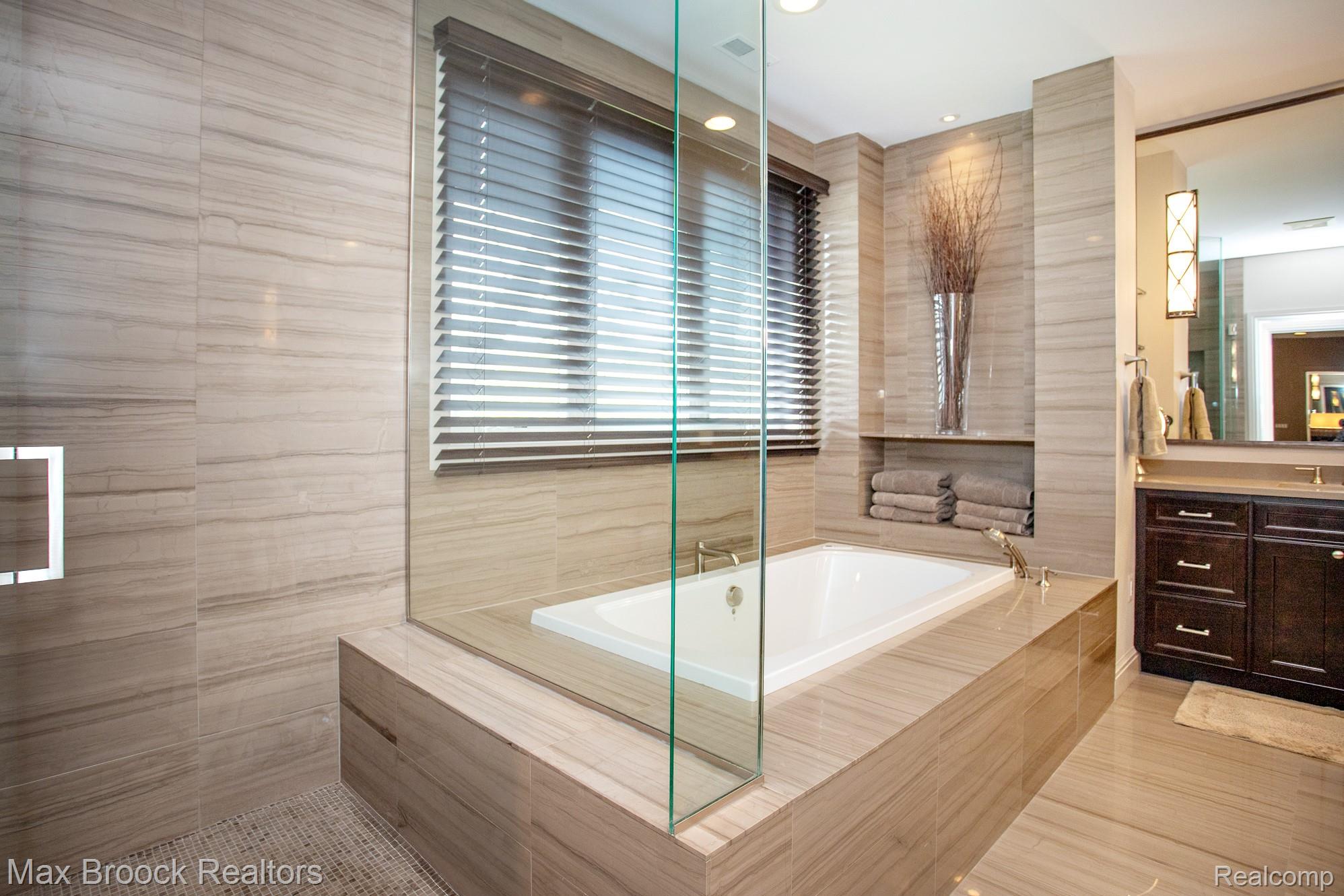 25925 York Road Royal Oak, MI 48067 - Photo 54 of 88 Full bath featuring a garden tub, vanity, and tile walls