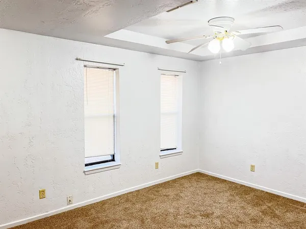 wooden floor in a hall with a window
