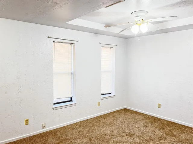 wooden floor in a hall with a window