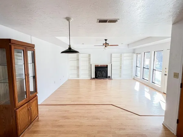 a blue kitchen with stainless steel appliances granite countertop a sink and a refrigerator