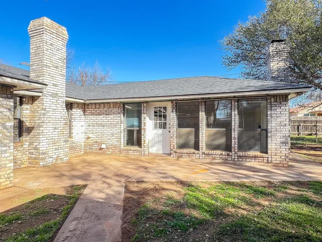 a view of yard with wooden fence