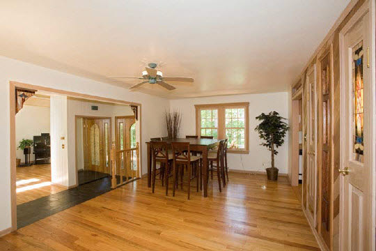 4808 Spring Creek Road Rockford, IL 61114 - Photo 4 of 6 a view of a dining room with furniture and wooden floor