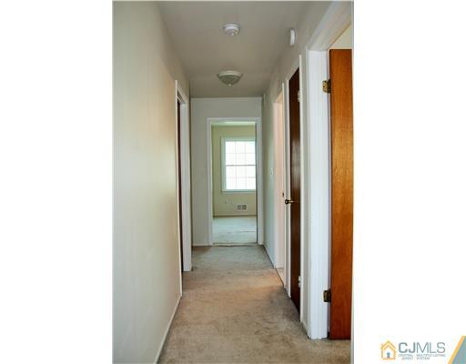 26 Ridge Road Edison, NJ 08817 - Photo 12 of 23 a view of a hallway with wooden floor