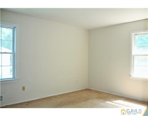 26 Ridge Road Edison, NJ 08817 - Photo 13 of 23 an empty room with windows
