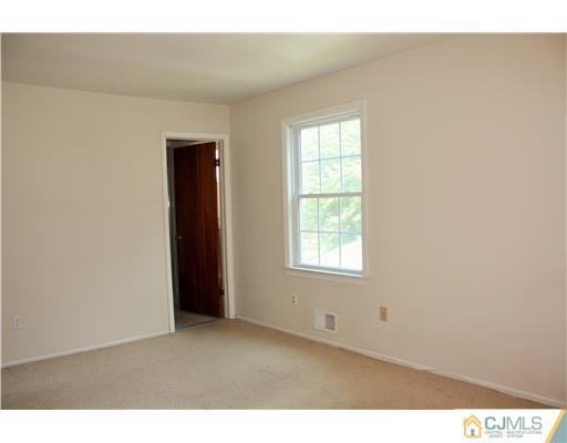26 Ridge Road Edison, NJ 08817 - Photo 14 of 23 a view of an empty room with a window