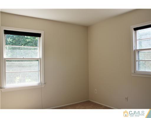 26 Ridge Road Edison, NJ 08817 - Photo 16 of 23 a view of an empty room with a window