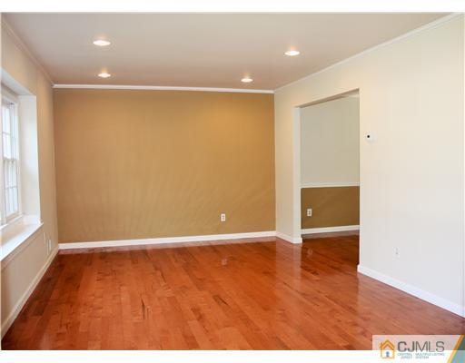 26 Ridge Road Edison, NJ 08817 - Photo 3 of 23 a view of an empty room with wooden floor