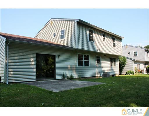 26 Ridge Road Edison, NJ 08817 - Photo 22 of 23 a front view of a house with a yard