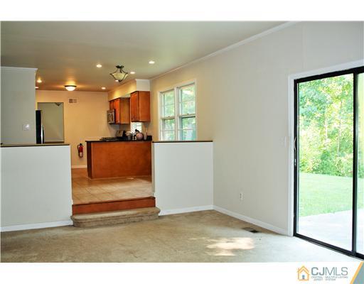 26 Ridge Road Edison, NJ 08817 - Photo 10 of 23 a view of a living room and kitchen with a large window