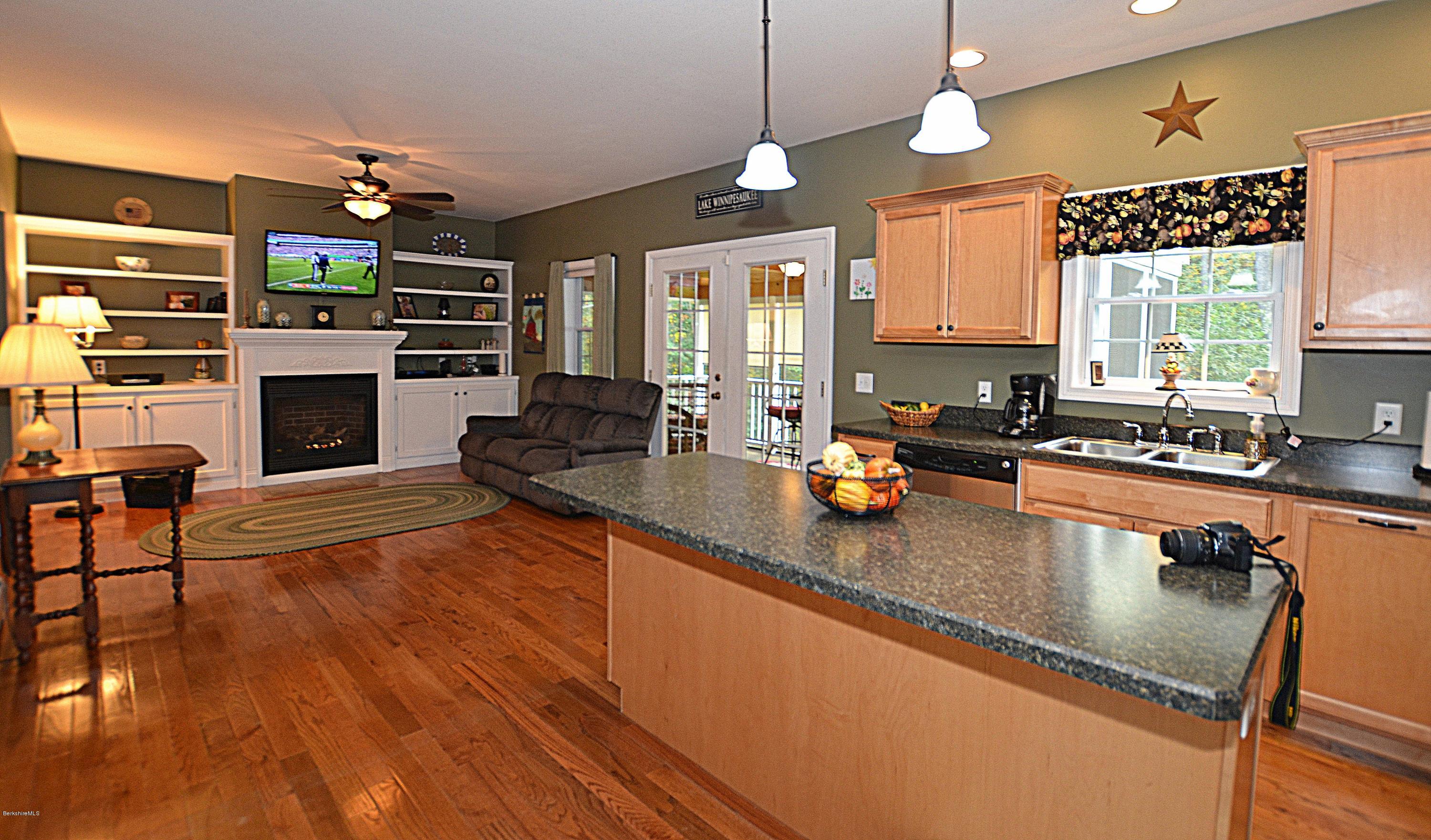 735 Upper Valley Road Washington, MA 01223 - Photo 11 of 33 a kitchen with stainless steel appliances granite countertop a stove a sink and a microwave