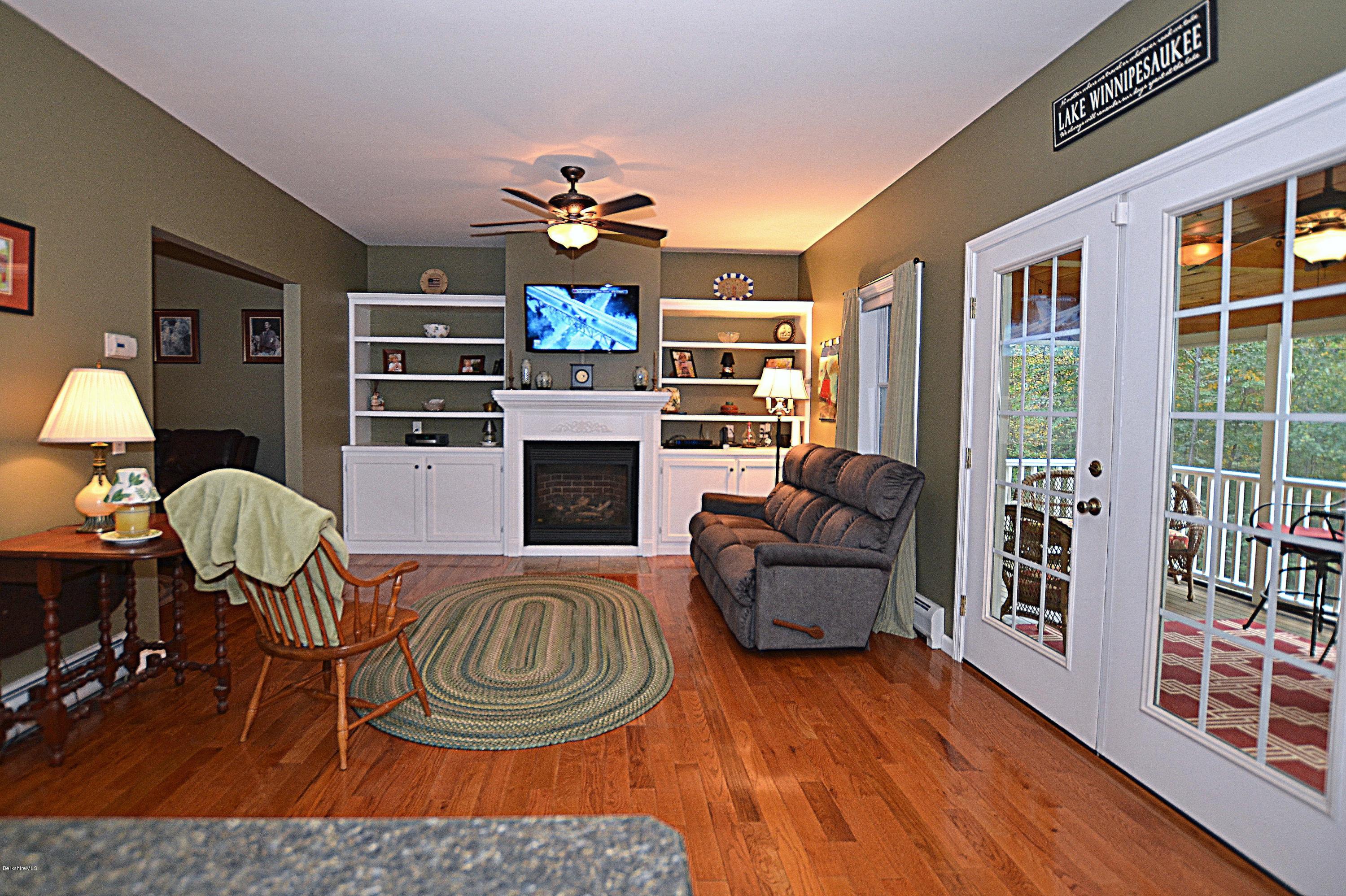 735 Upper Valley Road Washington, MA 01223 - Photo 13 of 33 a living room with furniture and a fireplace
