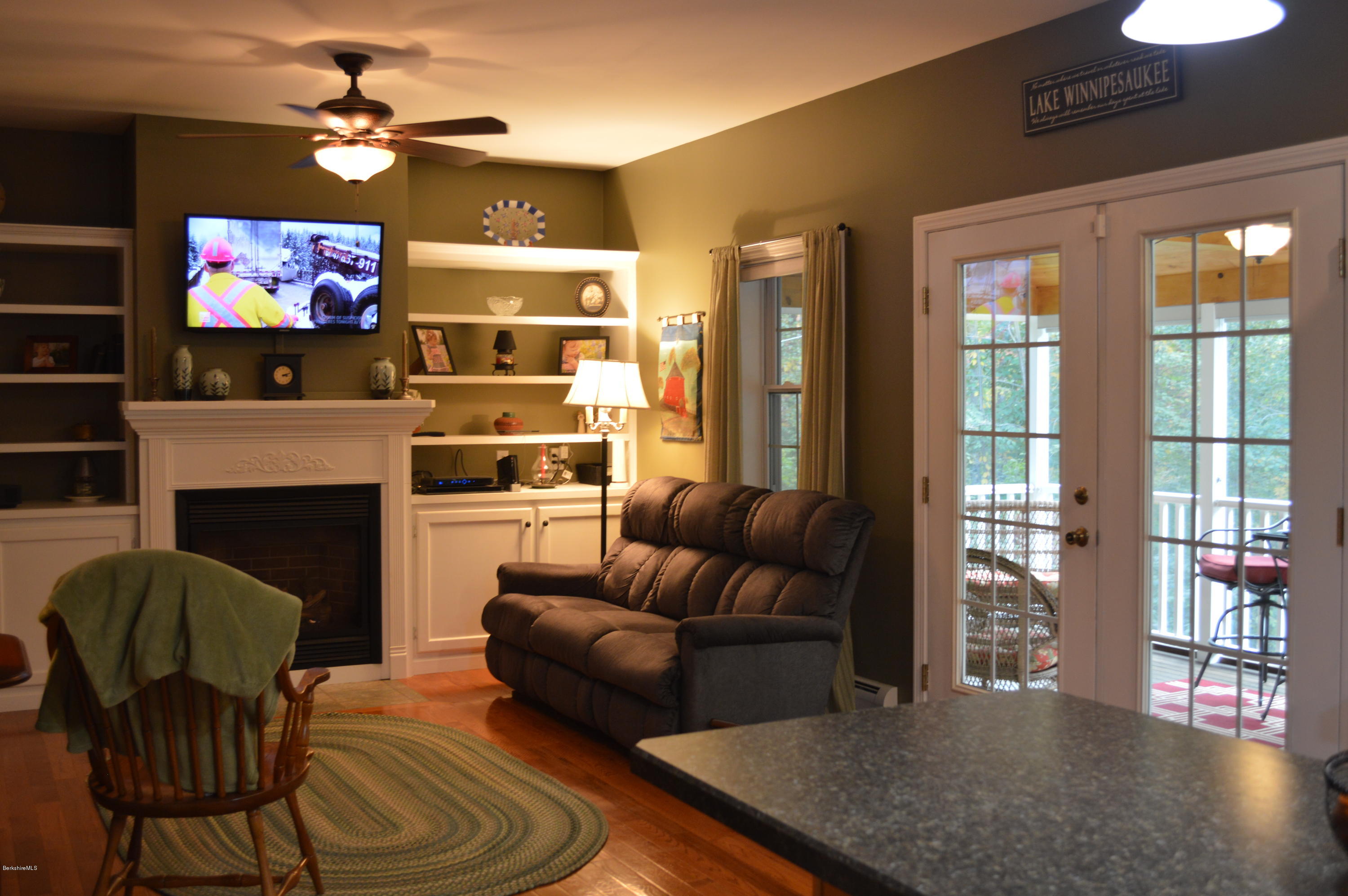 735 Upper Valley Road Washington, MA 01223 - Photo 14 of 33 a living room with furniture a flat screen tv and a fireplace