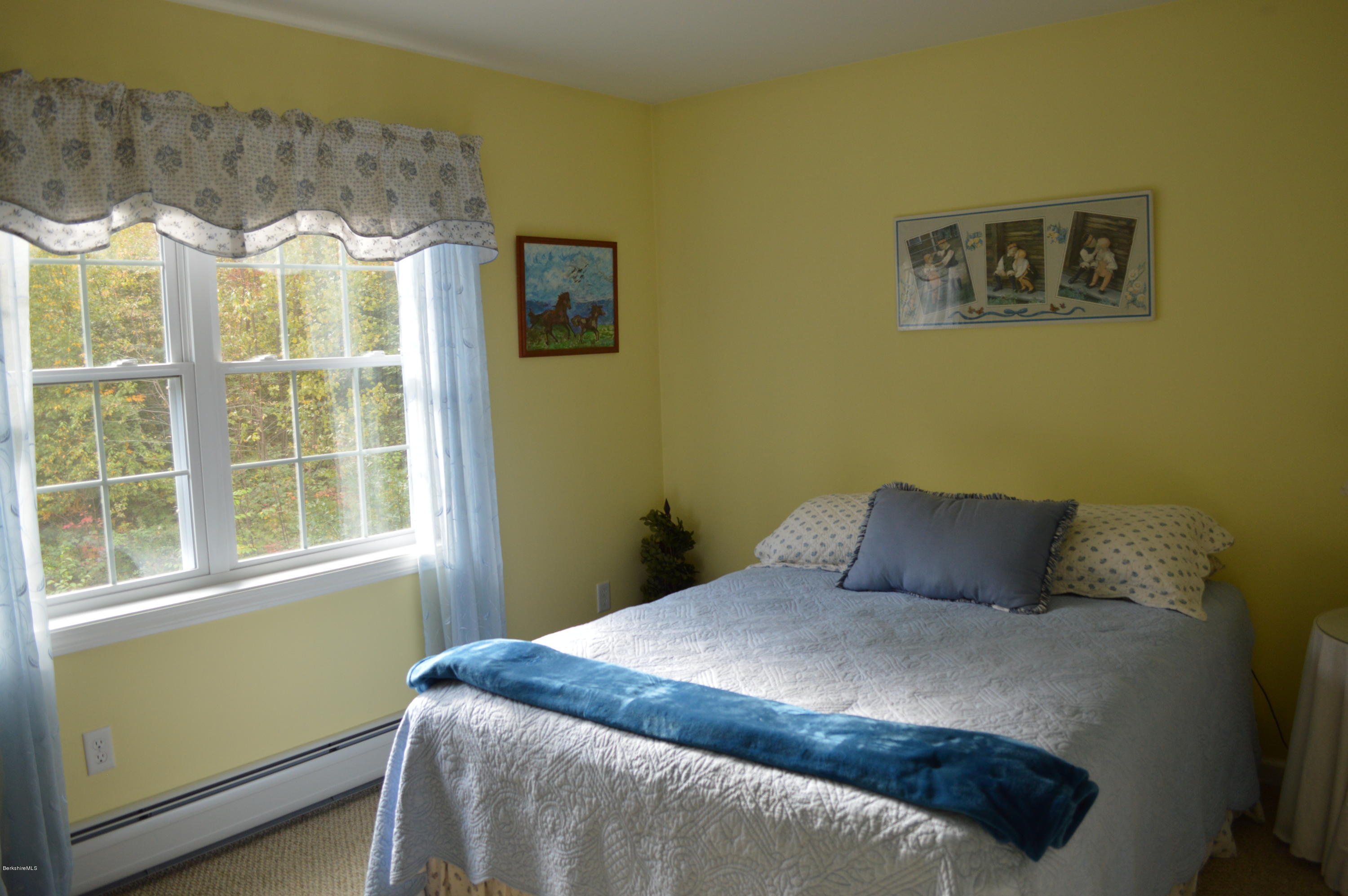 735 Upper Valley Road Washington, MA 01223 - Photo 24 of 33 a bedroom with a bed and a painting on the wall