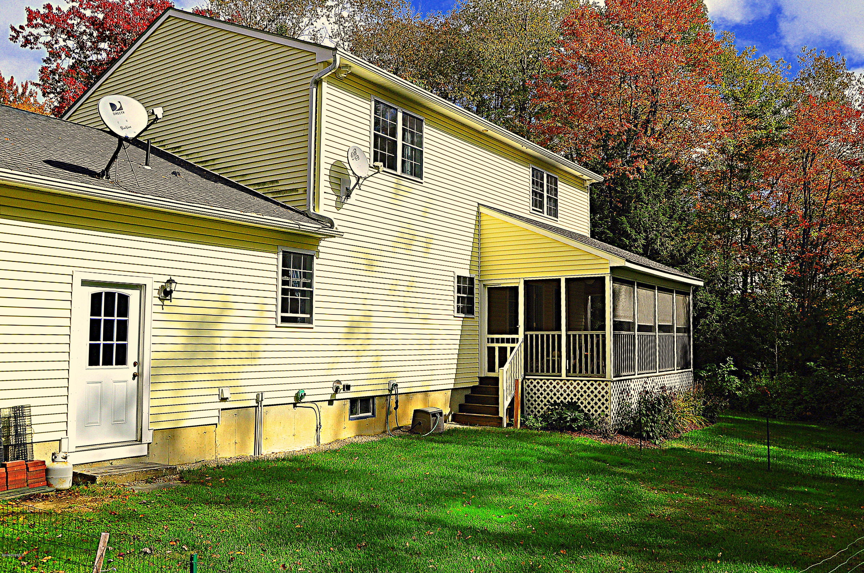 735 Upper Valley Road Washington, MA 01223 - Photo 33 of 33 a front view of a house with a garden